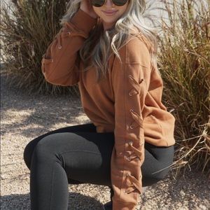 Lace up sweatshirt in rust orange